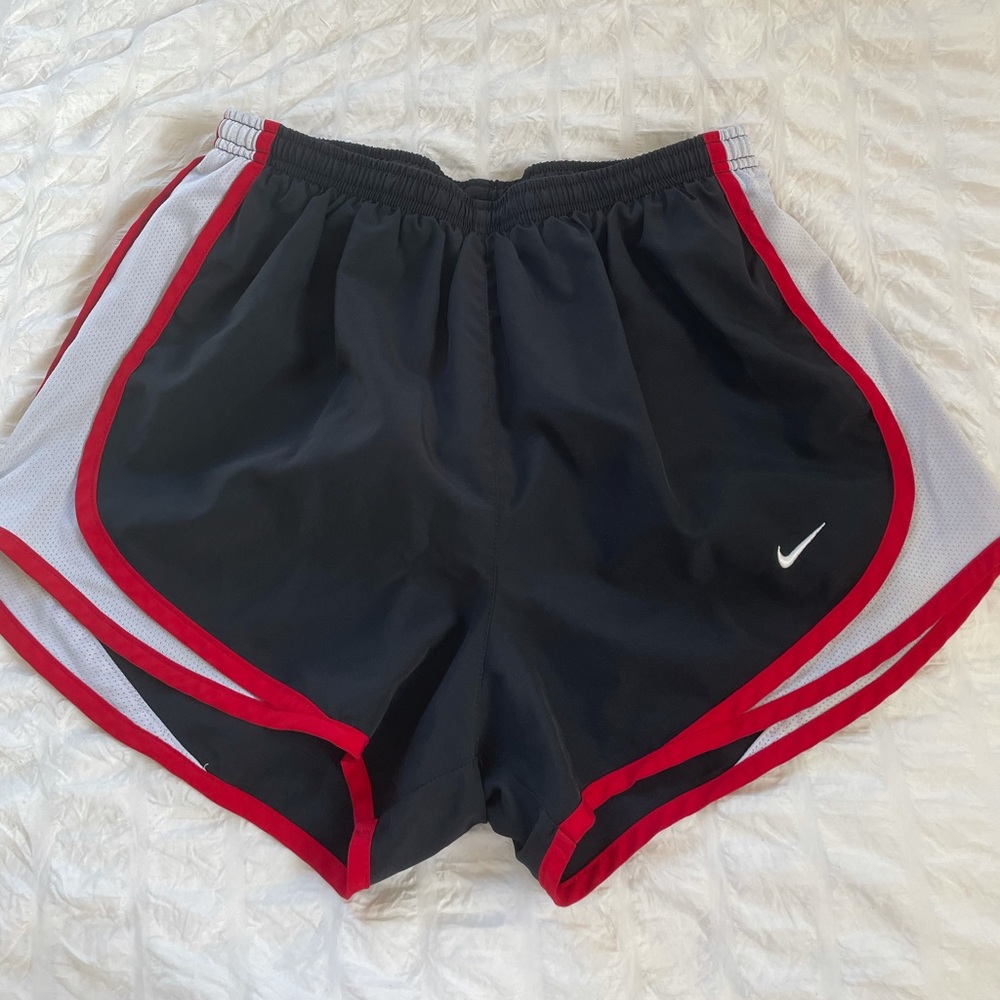 Red and black Nike shorts, size small
